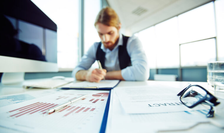 Office worker busy working with papers